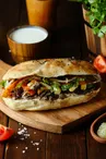 meat doner in the bread on wooden board